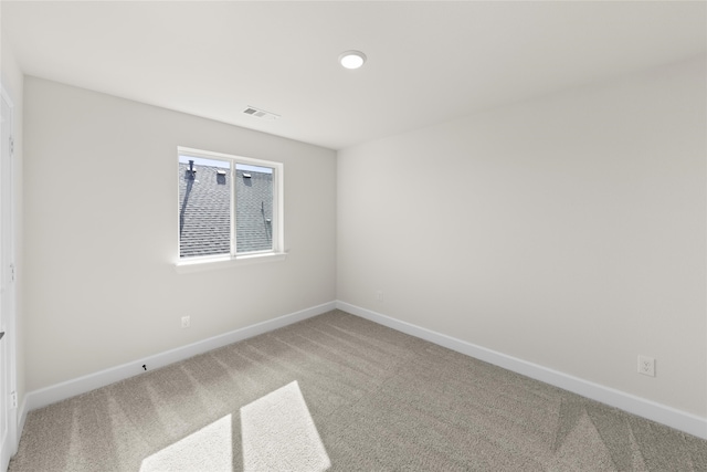 unfurnished room featuring carpet floors