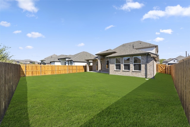 back of house featuring a yard