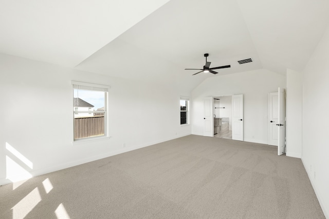 unfurnished living room with light colored carpet, ceiling fan, and lofted ceiling