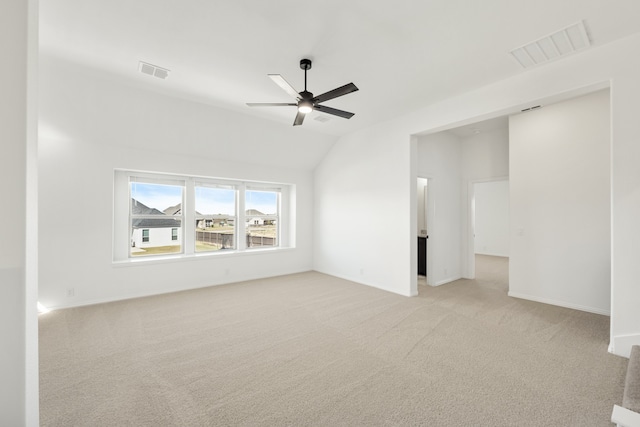 unfurnished living room featuring light carpet, ceiling fan, and lofted ceiling