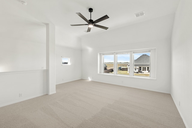 unfurnished living room with ceiling fan and light colored carpet