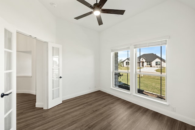 interior space featuring lofted ceiling, ceiling fan, and dark wood-type flooring