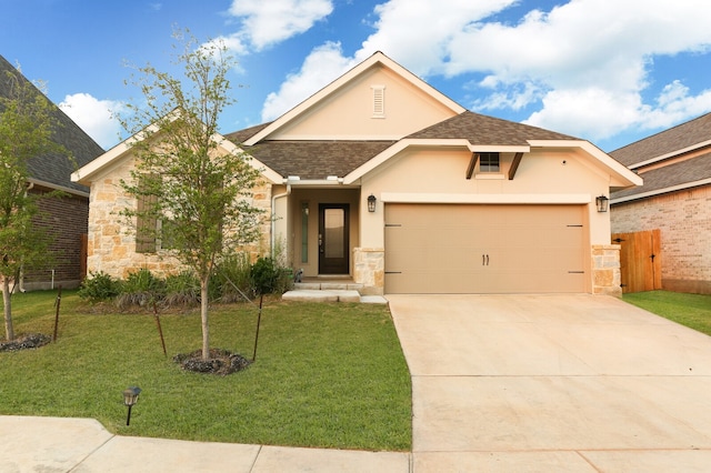 view of front facade with a garage and a front yard