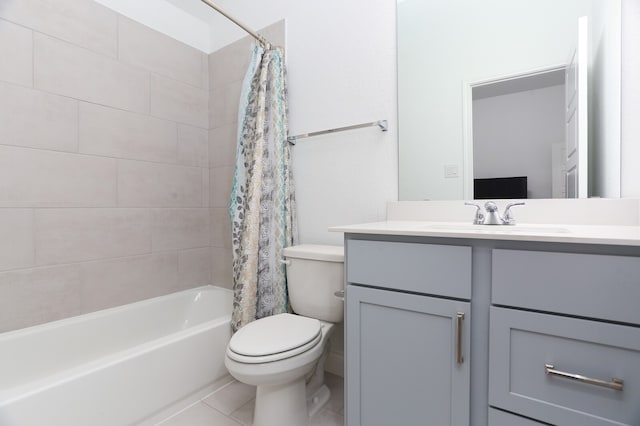 full bathroom featuring tile patterned floors, toilet, shower / bath combo with shower curtain, and vanity