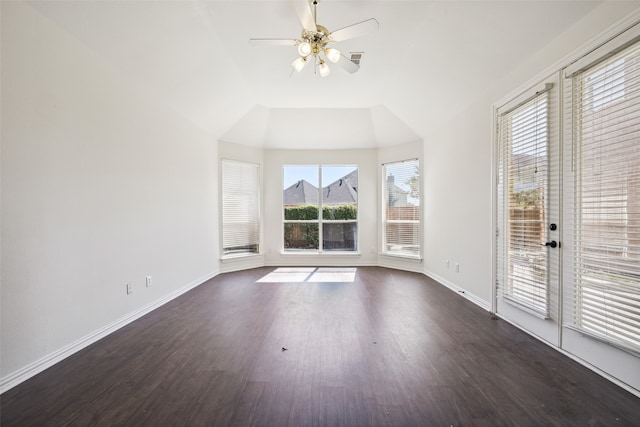 interior space featuring ceiling fan, lofted ceiling, and dark hardwood / wood-style flooring