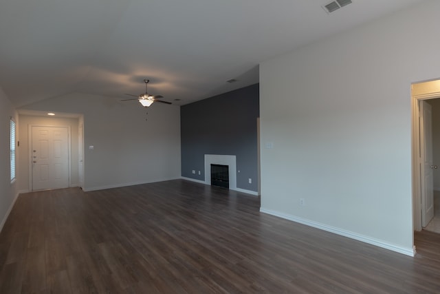 unfurnished living room featuring ceiling fan and dark wood-type flooring