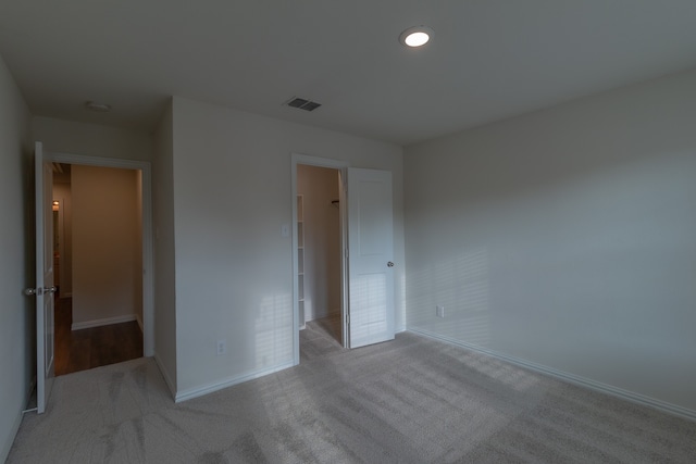 unfurnished bedroom featuring light colored carpet