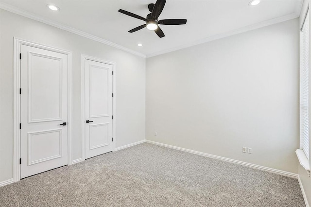 unfurnished bedroom with carpet, ceiling fan, and ornamental molding