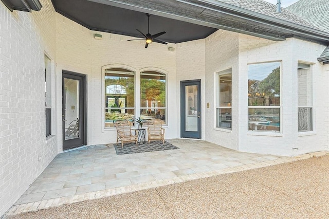 entrance to property with ceiling fan