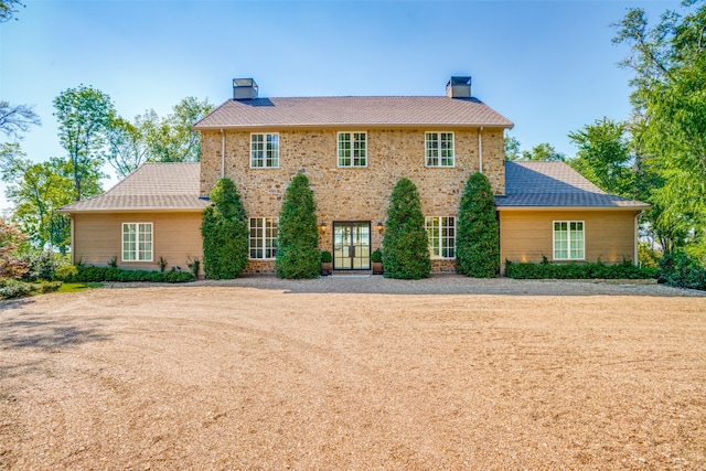 colonial inspired home featuring french doors