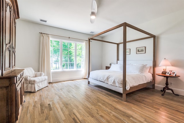 bedroom with wood-type flooring