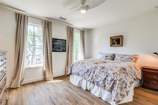 bedroom featuring ceiling fan and light hardwood / wood-style floors