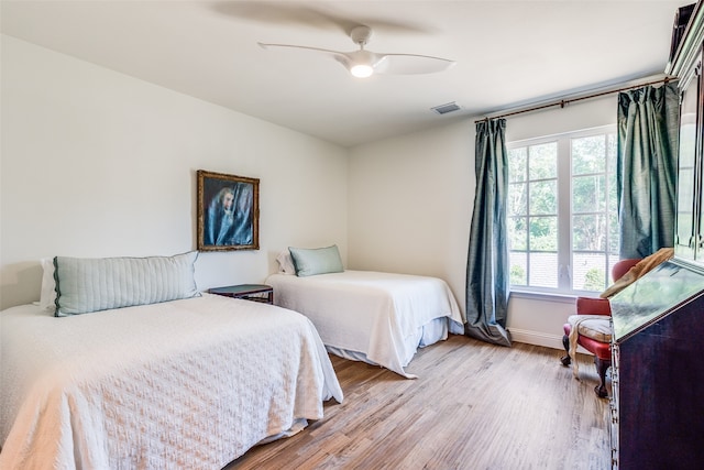 bedroom featuring ceiling fan and light wood-type flooring