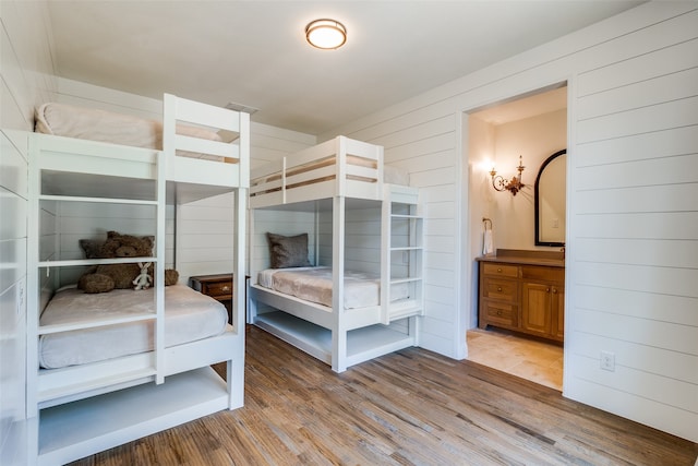 bedroom with hardwood / wood-style flooring