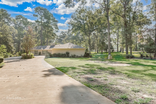 view of side of property featuring a yard