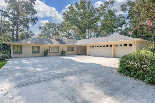 single story home featuring a garage