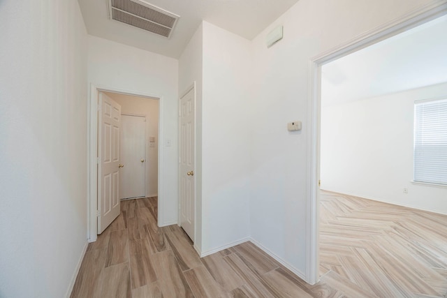 hall with light hardwood / wood-style flooring