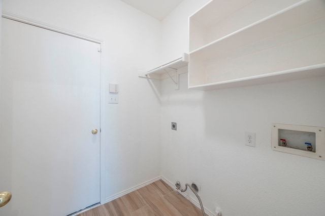 washroom featuring light hardwood / wood-style flooring, electric dryer hookup, washer hookup, and gas dryer hookup