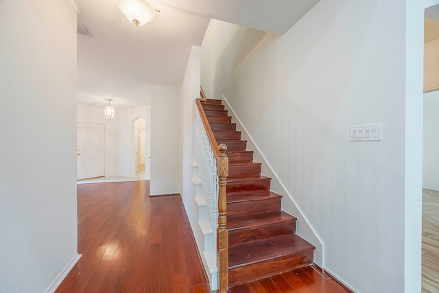 staircase featuring hardwood / wood-style flooring