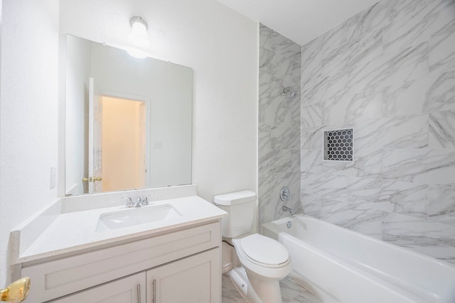 full bathroom with tiled shower / bath, vanity, and toilet