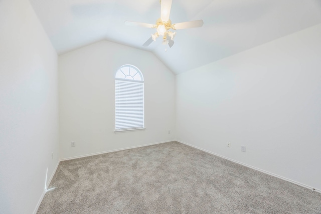 unfurnished room featuring light carpet, lofted ceiling, and ceiling fan