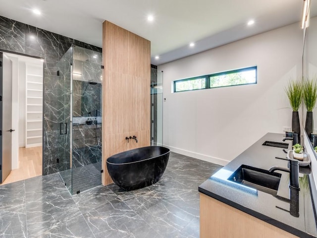 bathroom featuring separate shower and tub and vanity