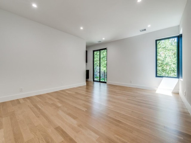 spare room with light hardwood / wood-style floors