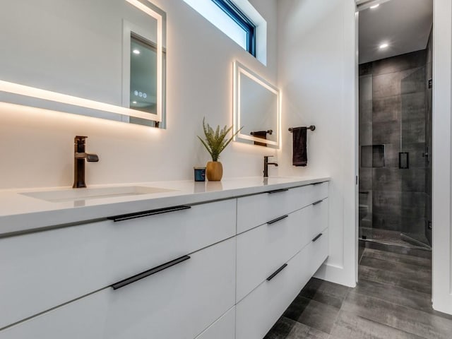 bathroom with vanity and walk in shower