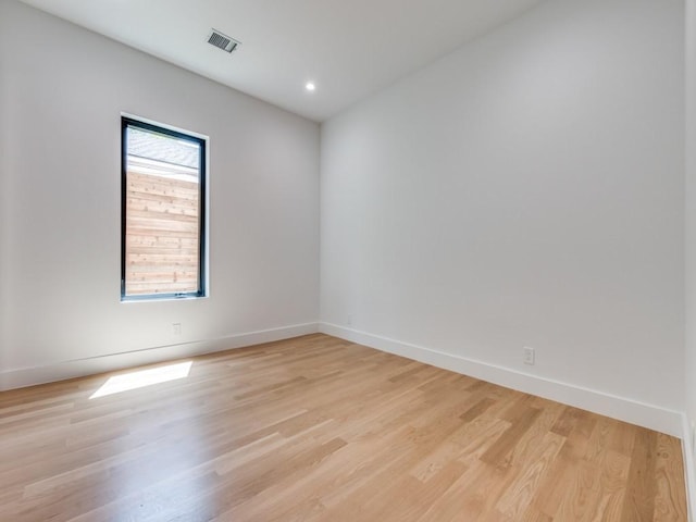 unfurnished room with light hardwood / wood-style flooring