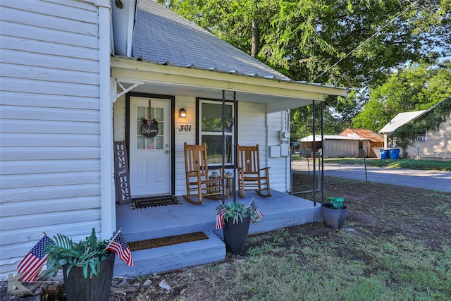 property entrance featuring covered porch