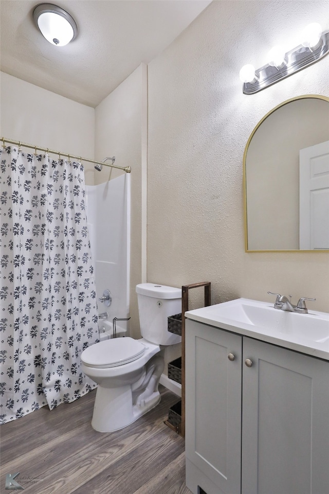 bathroom with vanity, toilet, wood-type flooring, and a shower with shower curtain