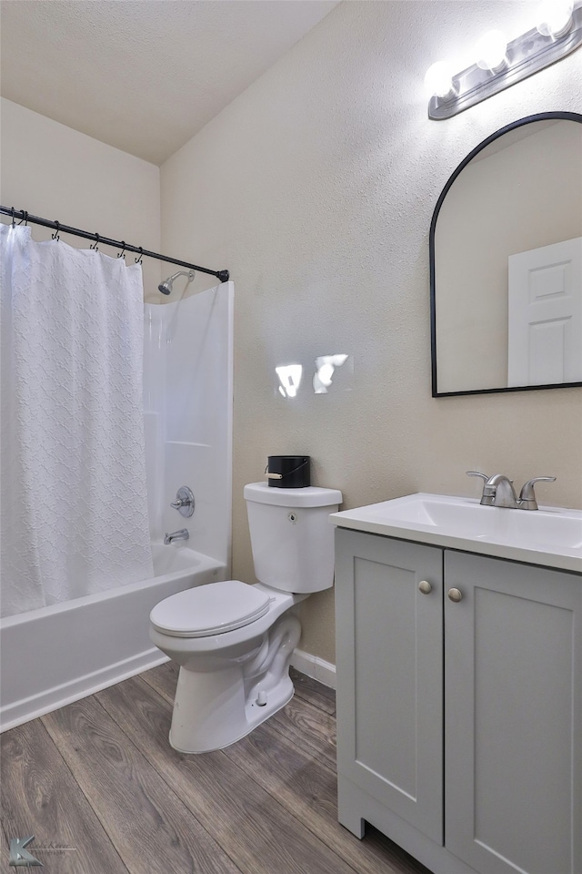 full bathroom featuring vanity, toilet, shower / bath combination with curtain, and hardwood / wood-style floors