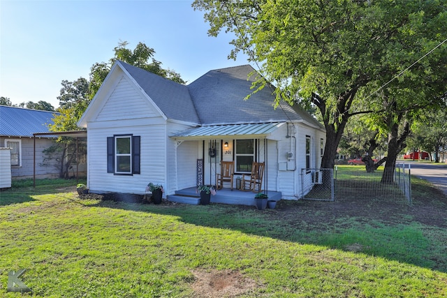 view of front of house featuring a front yard and covered porch