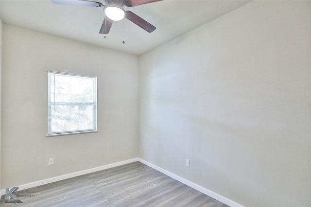 spare room featuring light wood-type flooring and ceiling fan