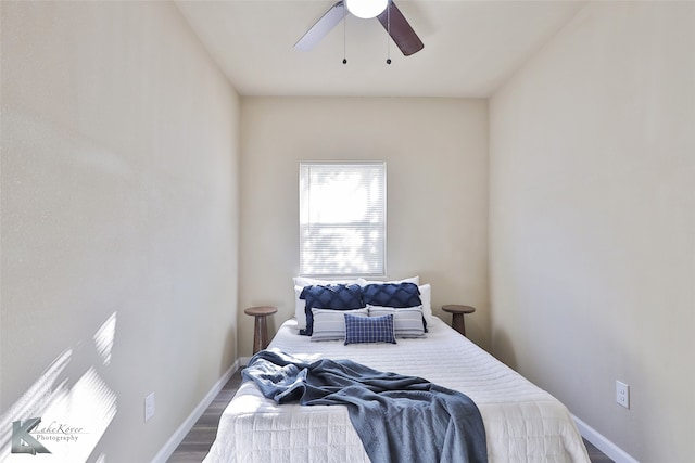 bedroom with hardwood / wood-style floors and ceiling fan