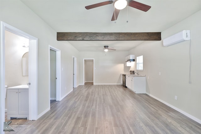 unfurnished living room featuring a wall mounted air conditioner, ceiling fan, beamed ceiling, and light hardwood / wood-style floors