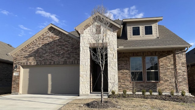 view of front of home with a garage, concrete driveway, brick siding, and roof with shingles