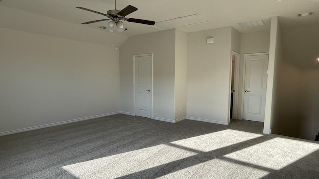 unfurnished bedroom featuring carpet floors, a ceiling fan, attic access, and baseboards