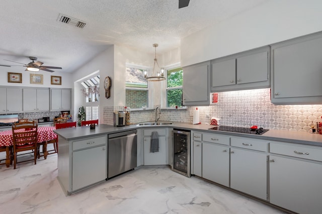 kitchen with dishwasher, sink, beverage cooler, kitchen peninsula, and pendant lighting