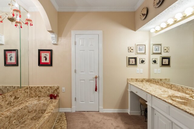 bathroom featuring vanity, tiled bath, and crown molding