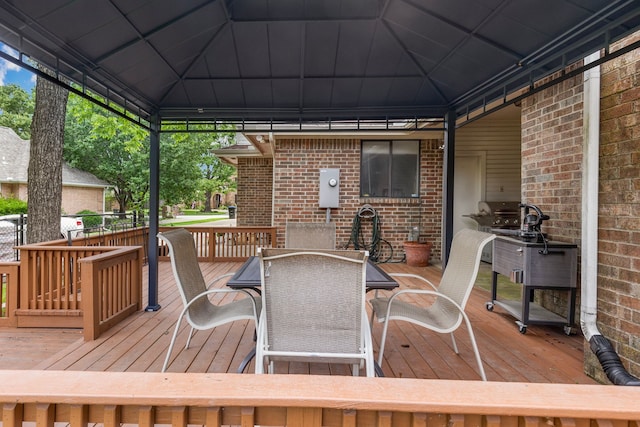 wooden terrace with outdoor dining area