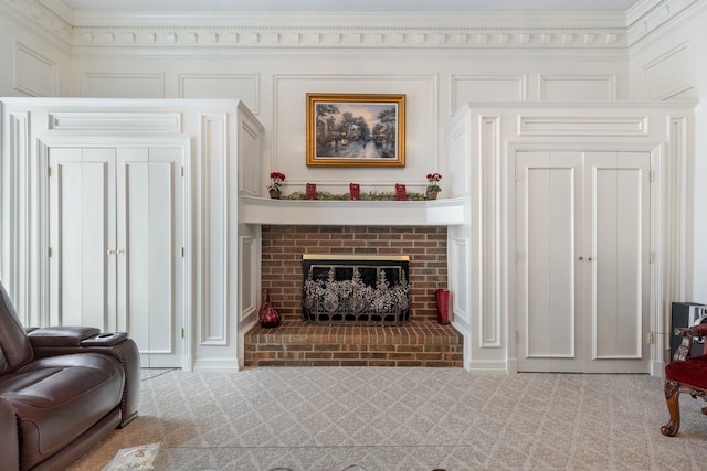 living room with light colored carpet, crown molding, and a brick fireplace