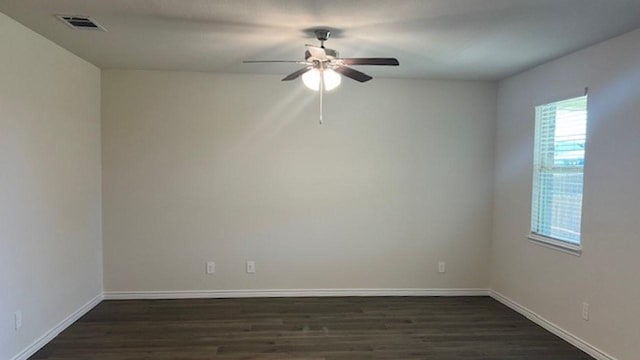 211 Bobcat Ln, Caddo Mills, TX 75135 - spare room featuring baseboards, visible vents, a ceiling fan, and dark wood-style flooring