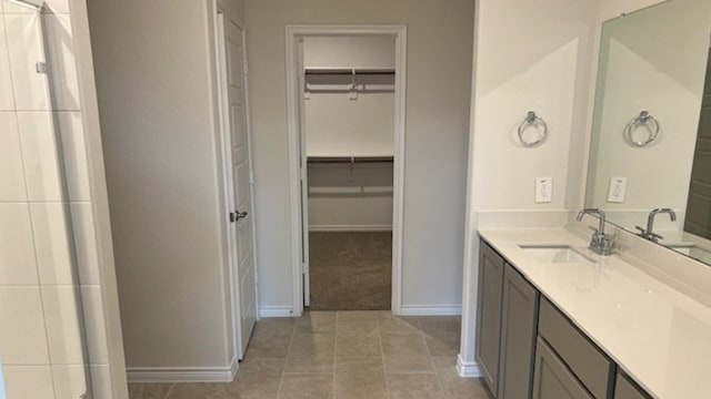 bathroom with tile patterned flooring and vanity