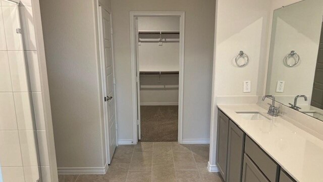 211 Bobcat Ln, Caddo Mills, TX 75135 - full bath featuring baseboards, a spacious closet, tile patterned flooring, and vanity