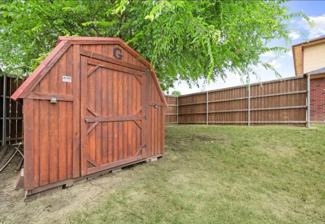 view of outdoor structure featuring a lawn