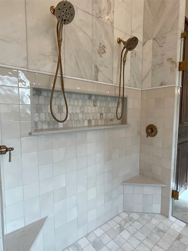 bathroom with a tile shower