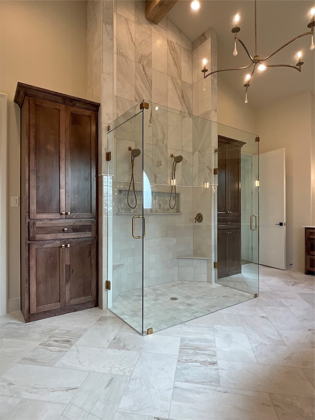 bathroom featuring high vaulted ceiling, vanity, beamed ceiling, and a shower with shower door