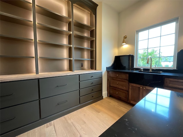 office space featuring sink and light hardwood / wood-style floors