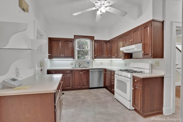 kitchen with stainless steel dishwasher, ceiling fan, white gas range, and sink